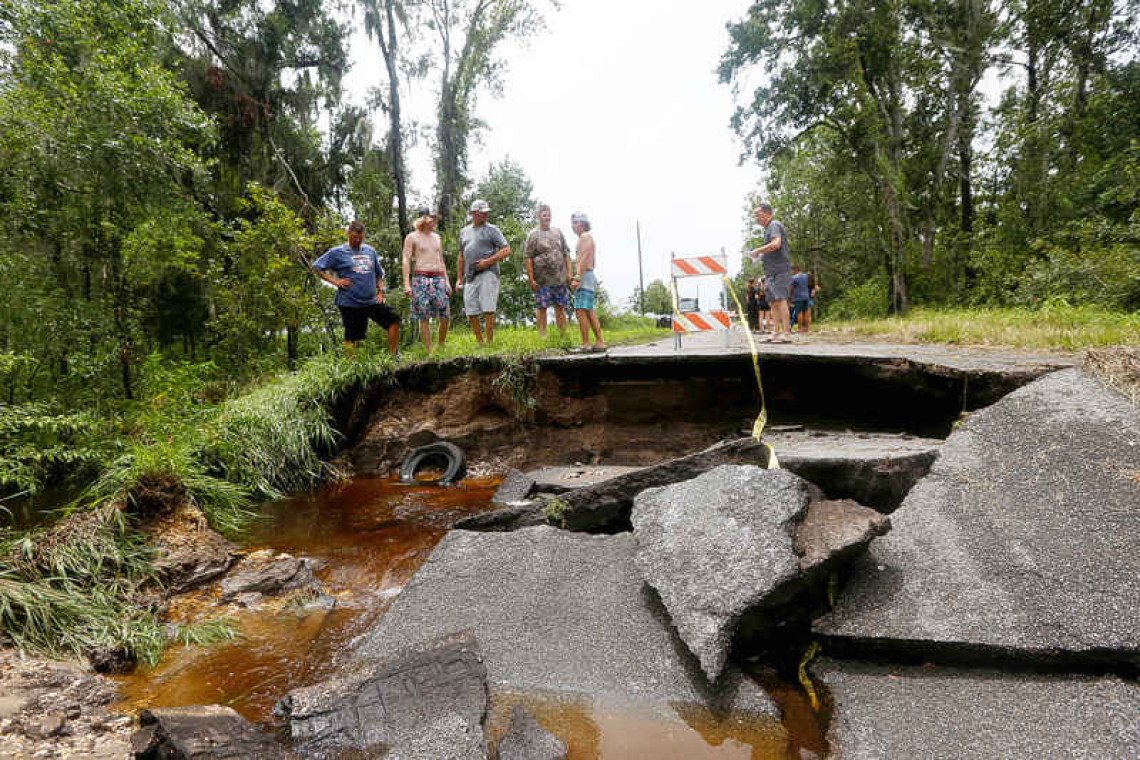 Debby, now a tropical storm,  soaks northern Florida, 6 dead